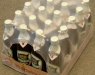 Групповая упаковка стеклянных бутылок с пивом